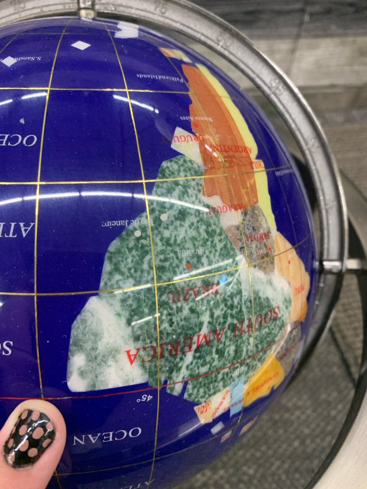 GLOBE WITH DIFFERENT STONE COUNTRIES.