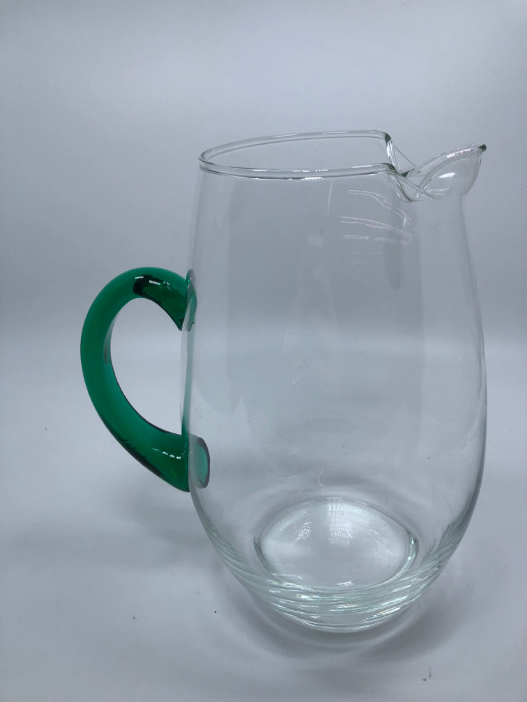 CLEAR GLASS PITCHER W/GREEN GLASS HANDLE.
