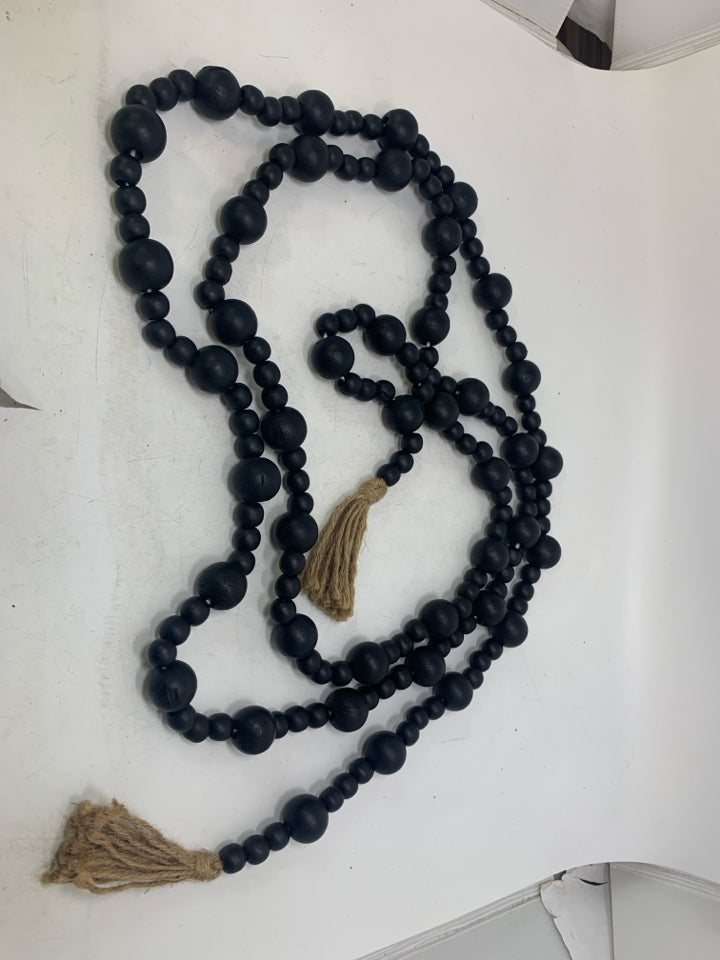 BLACK BEADS W/ TASSELS GARLAND.