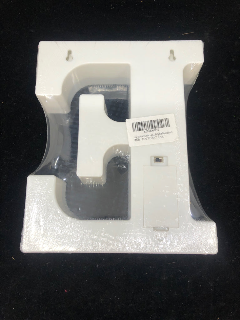 NIP LIGHT UP "E" WHITE SIGN.