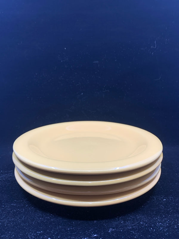 4 MUSTARD YELLOW LUNCH PLATES.