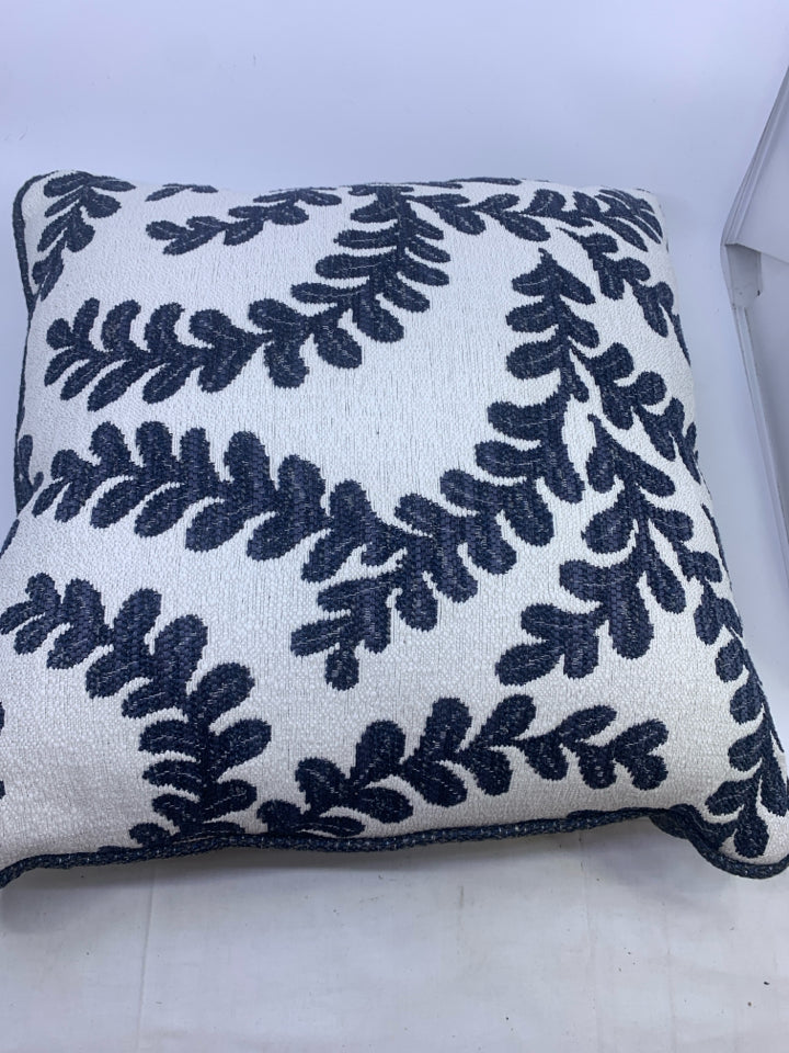 NAVY LEAF DETAIL, WHITE AND NAVY PILLOW.