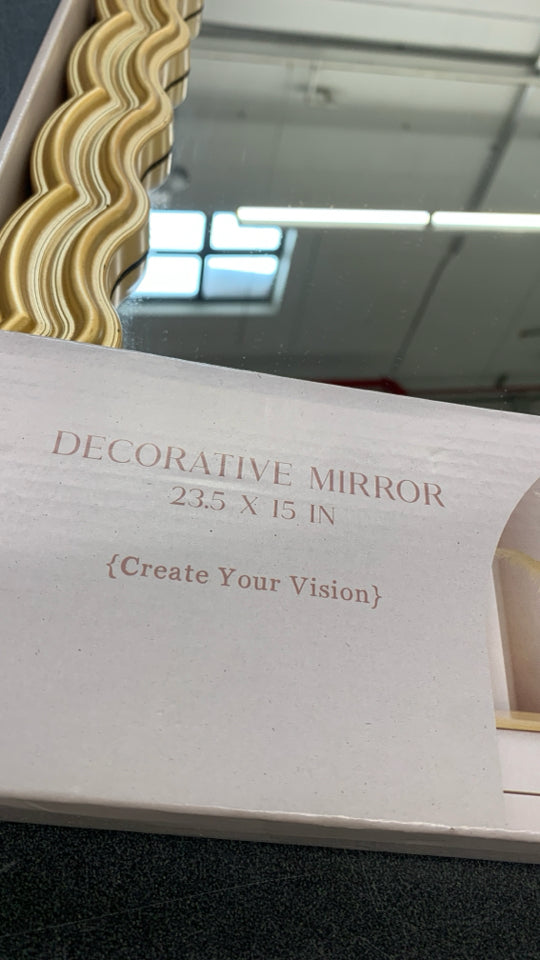 NIB DECORATIVE GOLD/WAVY MIRROR.