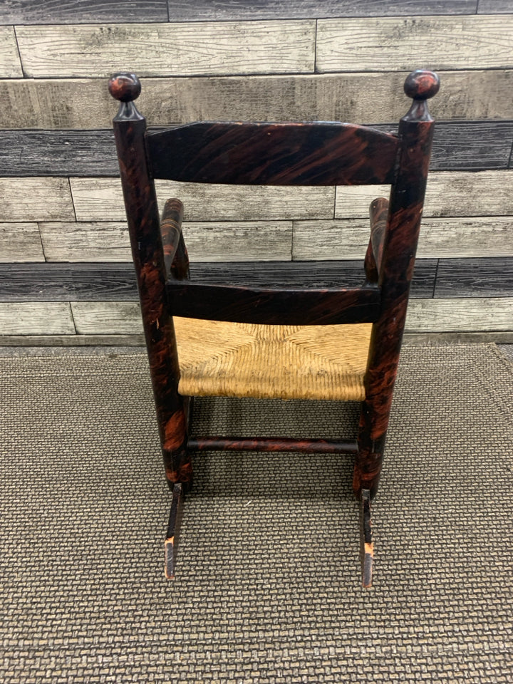 VTG SMALL CHILDS ROCKING CHAIR W WICKER BOTTOM.