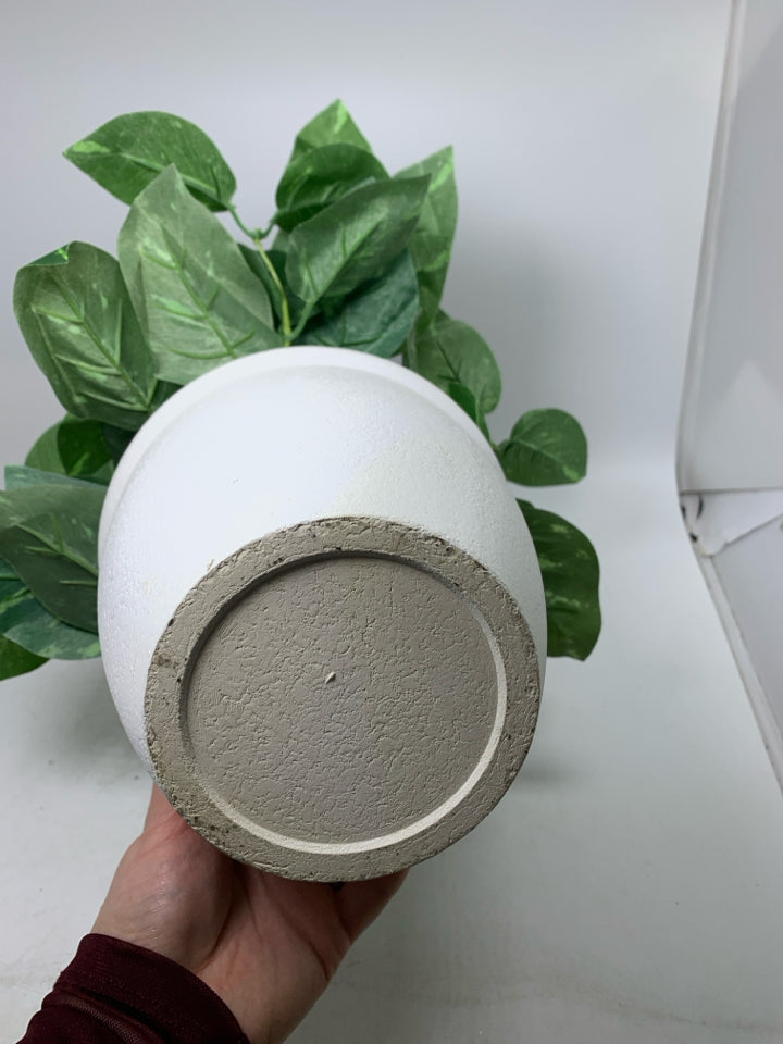 WHITE PLANTER W/ FAUX LEAVES.