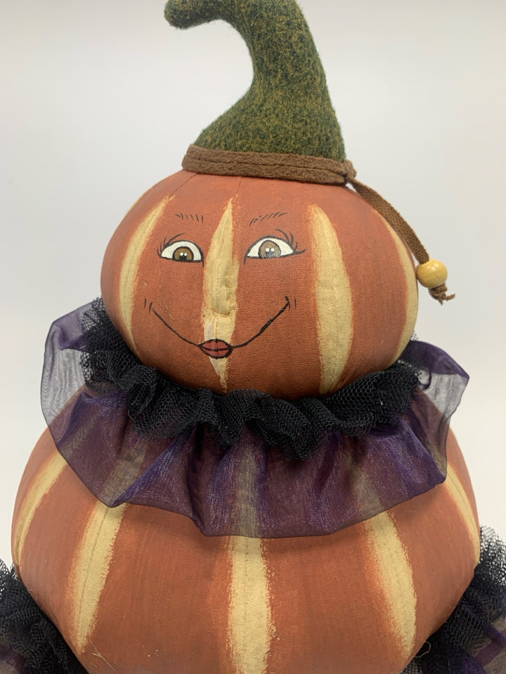 PRIMITIVE PAINTED PLUSH SITTING PUMPKIN WITH RUFFLES.