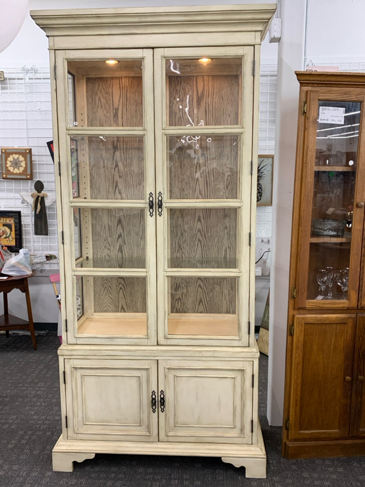DISTRESSED CREME CABINET- 4 DOOR+ LIGHTS.