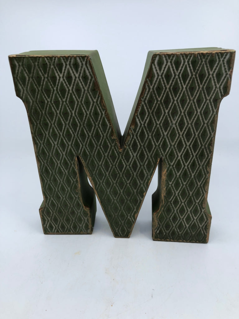 GREEN METAL LETTER "M".