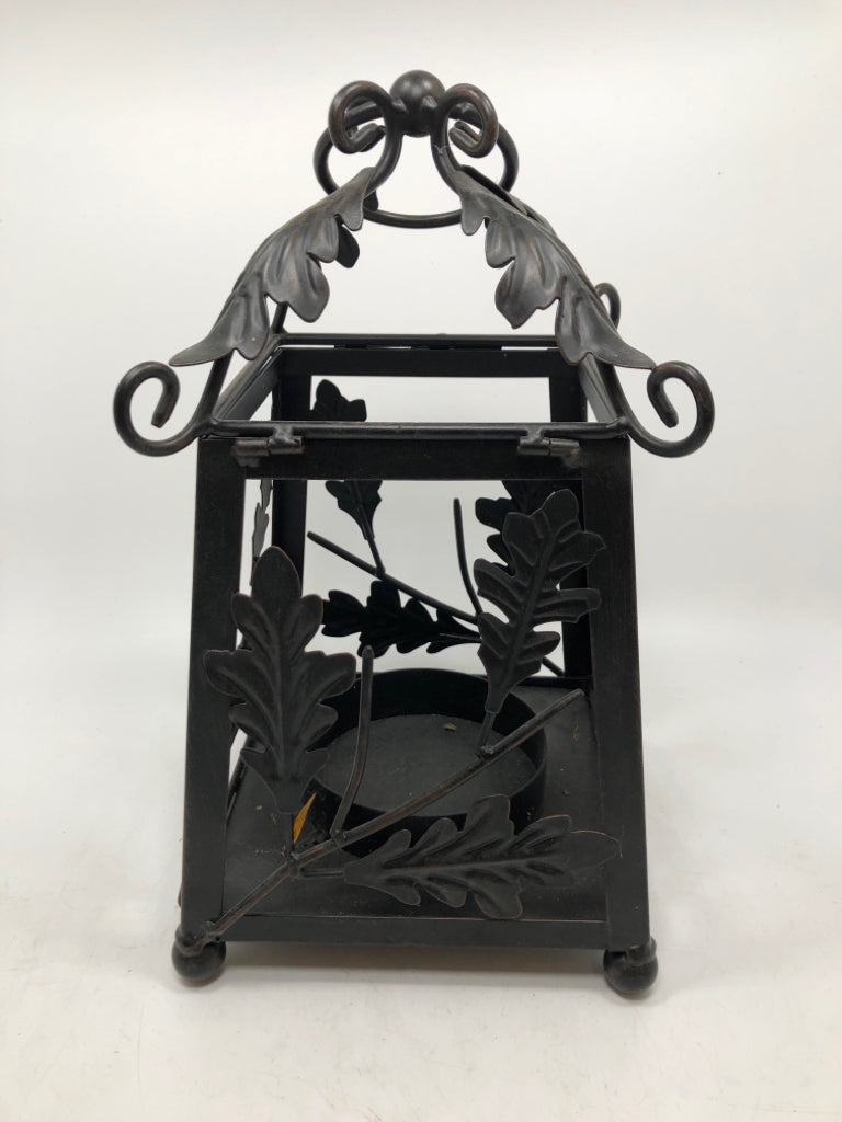 BLACK METAL LEAF EMBOSSED CANDLE LANTERN.