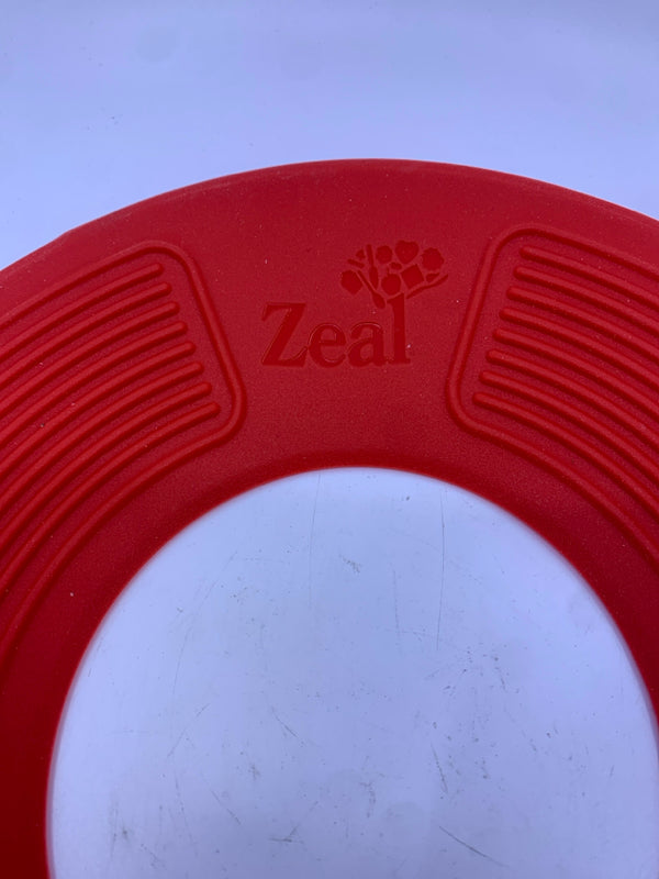 ZEAL RED RUBBER MATS TO STOP POTS FROM BOILING OVER.