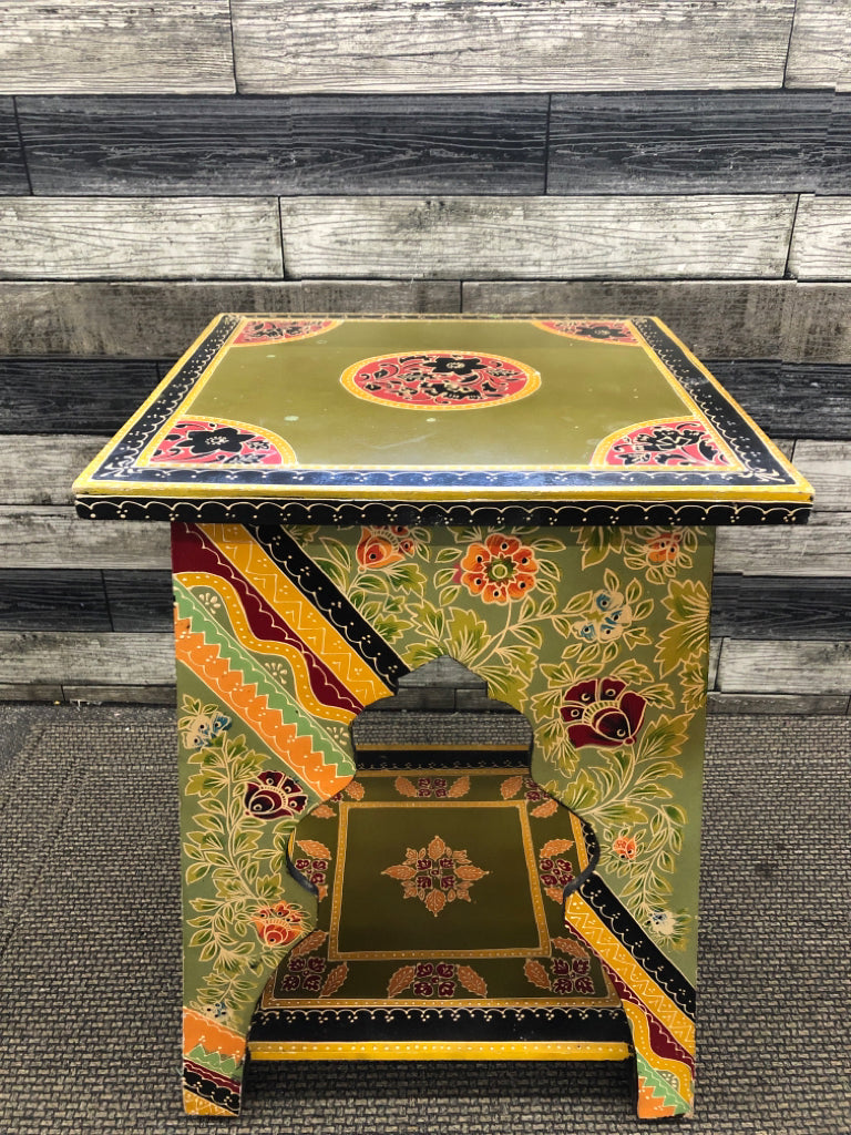 COLORFUL END TABLE W/GREEN TOP & YELLOW BASE & FLORAL LINEWORK.