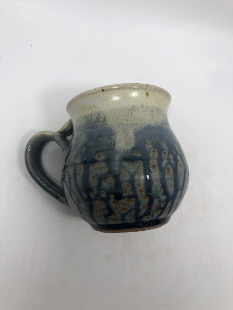 TEAL/BEIGE POTTERY MUG.