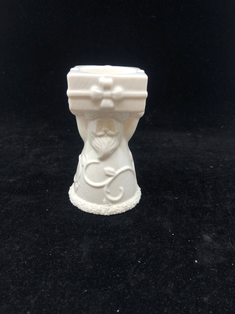WHITE SANTA HOLDING PRESENT YANKEE CANDLE TEA LIGHT.