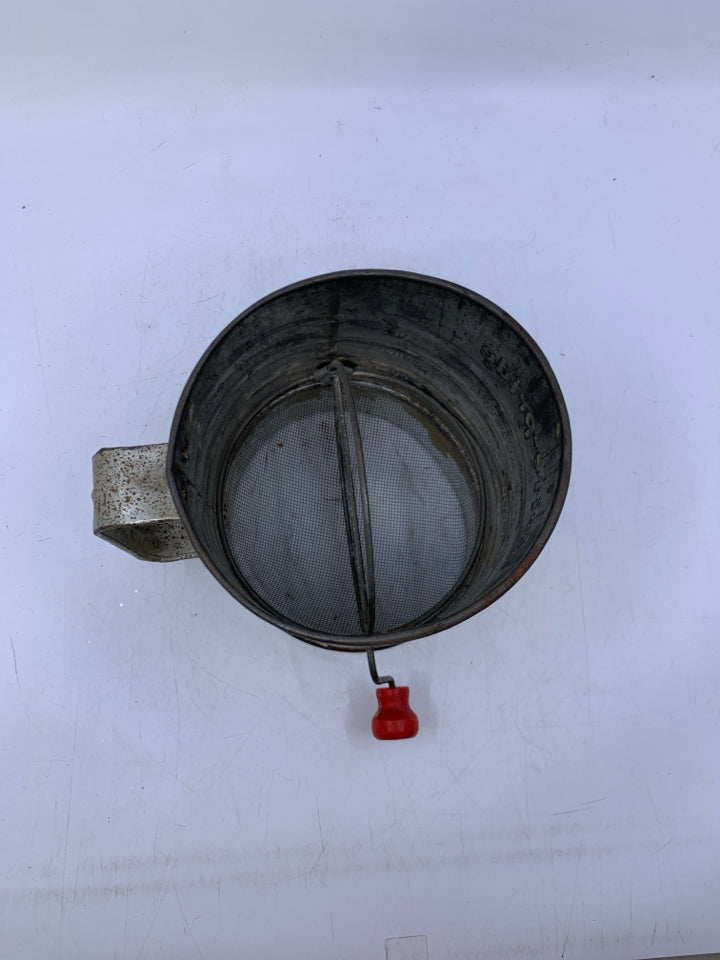 BRITE-PRIDE 5 CUP FLOUR SIFTER W/ RED HANDLE.