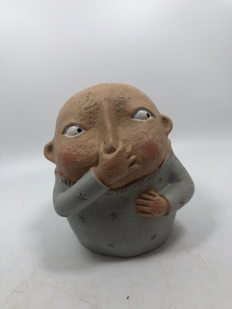 BOY HOLDING NOSE.