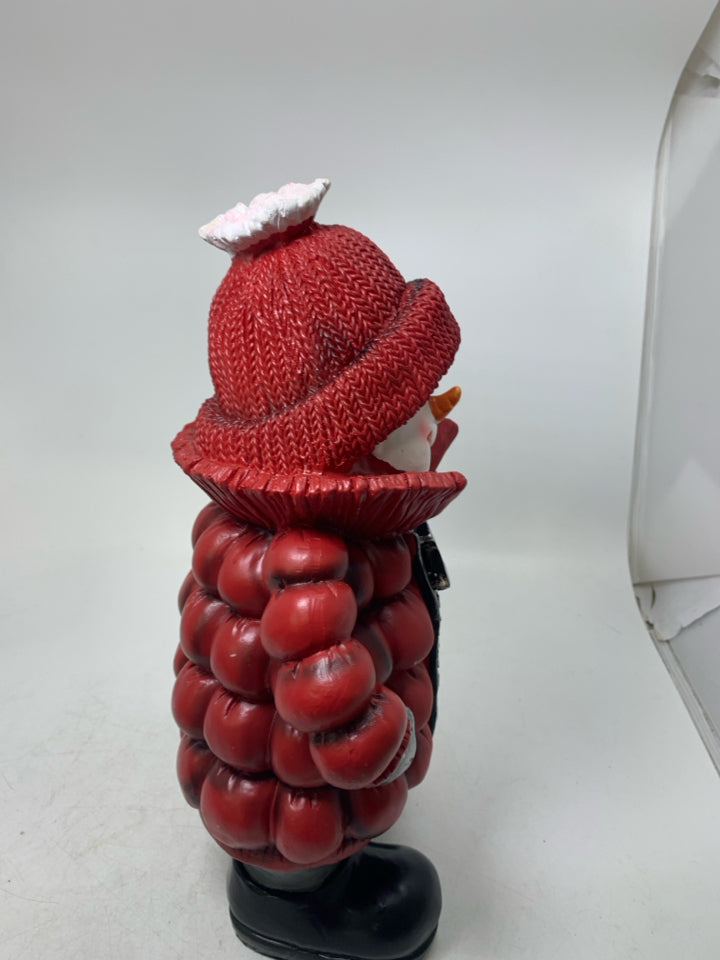 SNOWMAN IN RED PUFFER COAT HOLDING TREE.