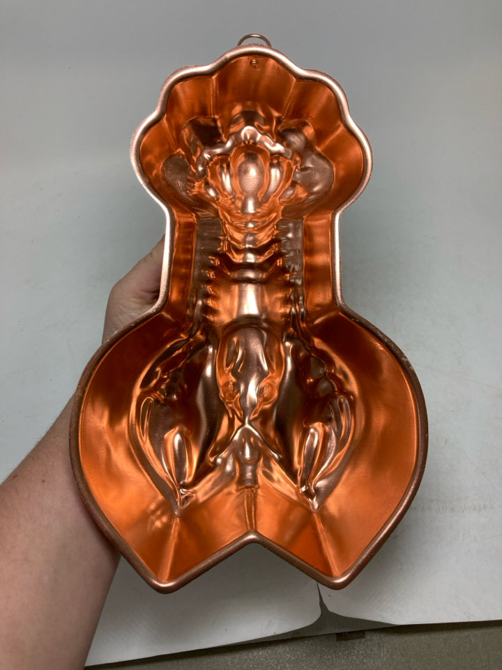 LOBSTER SHAPED COPPER COLORED MOLD.