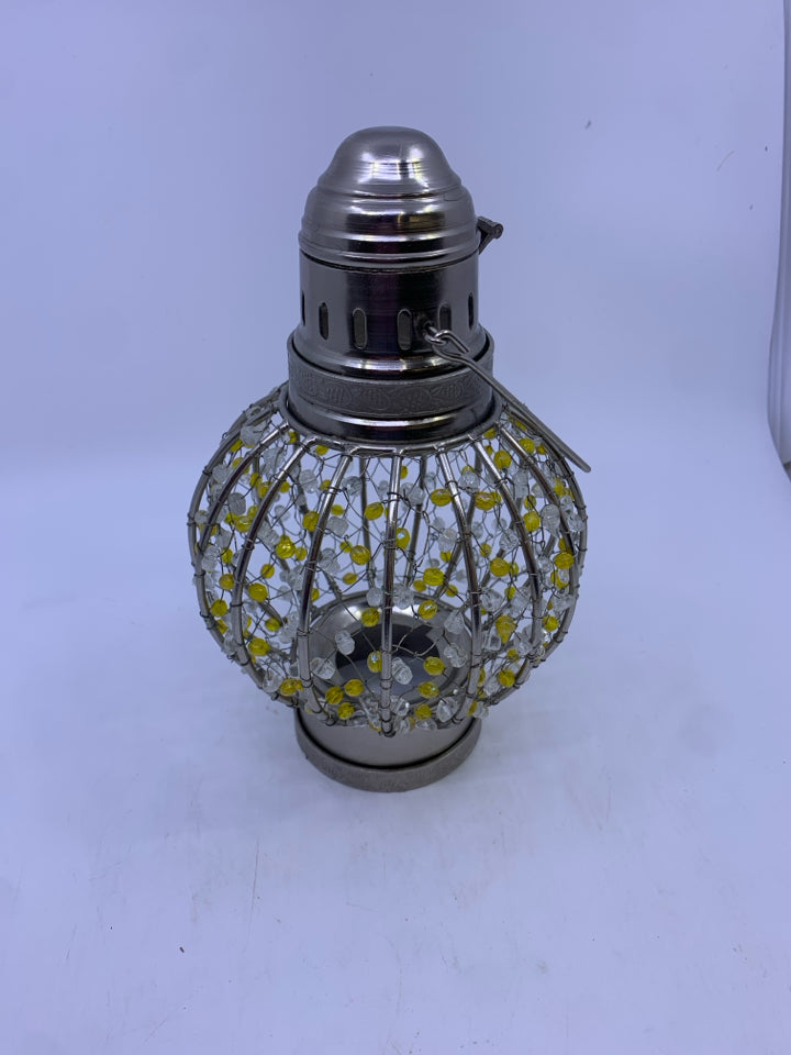 SILVER METAL YELLOW WHITE BEADED CANDLE LAMP.
