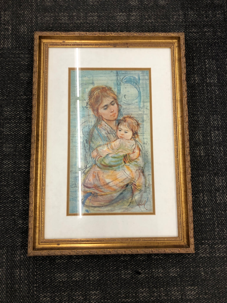 WOMAN HOLDING CHILD.