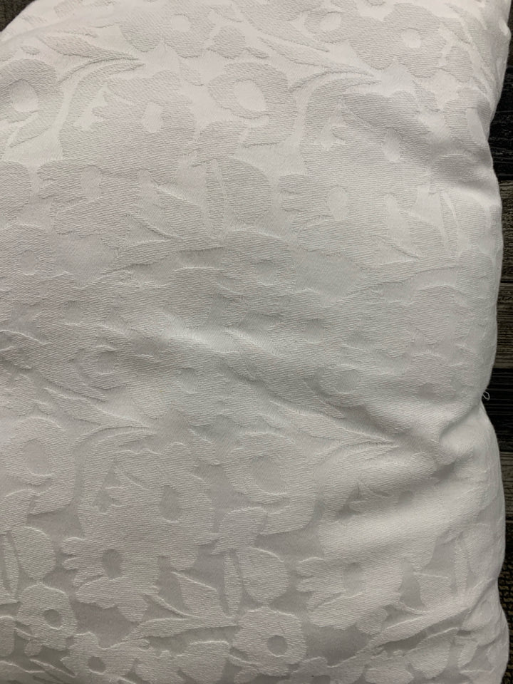WHITE FLORAL THROW PILLOW.