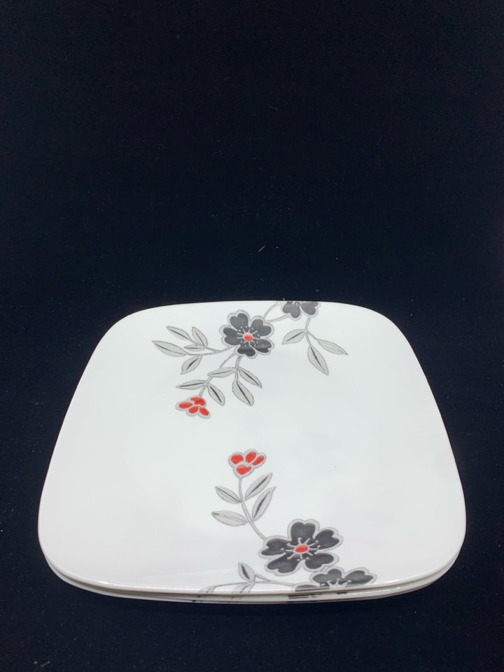 4 CORELLE DINNER PLATES W/RED AND BLACK FLORAL.