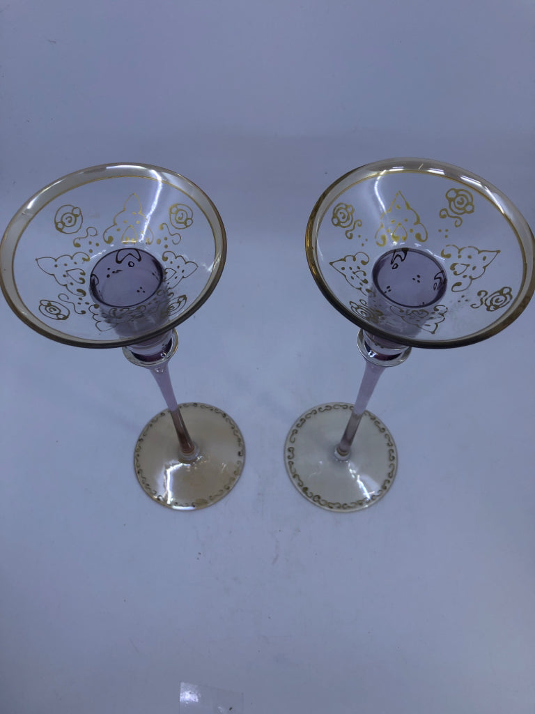 2 TALL GOLD AND PURPLE TAPER CANDLE HOLDERS.
