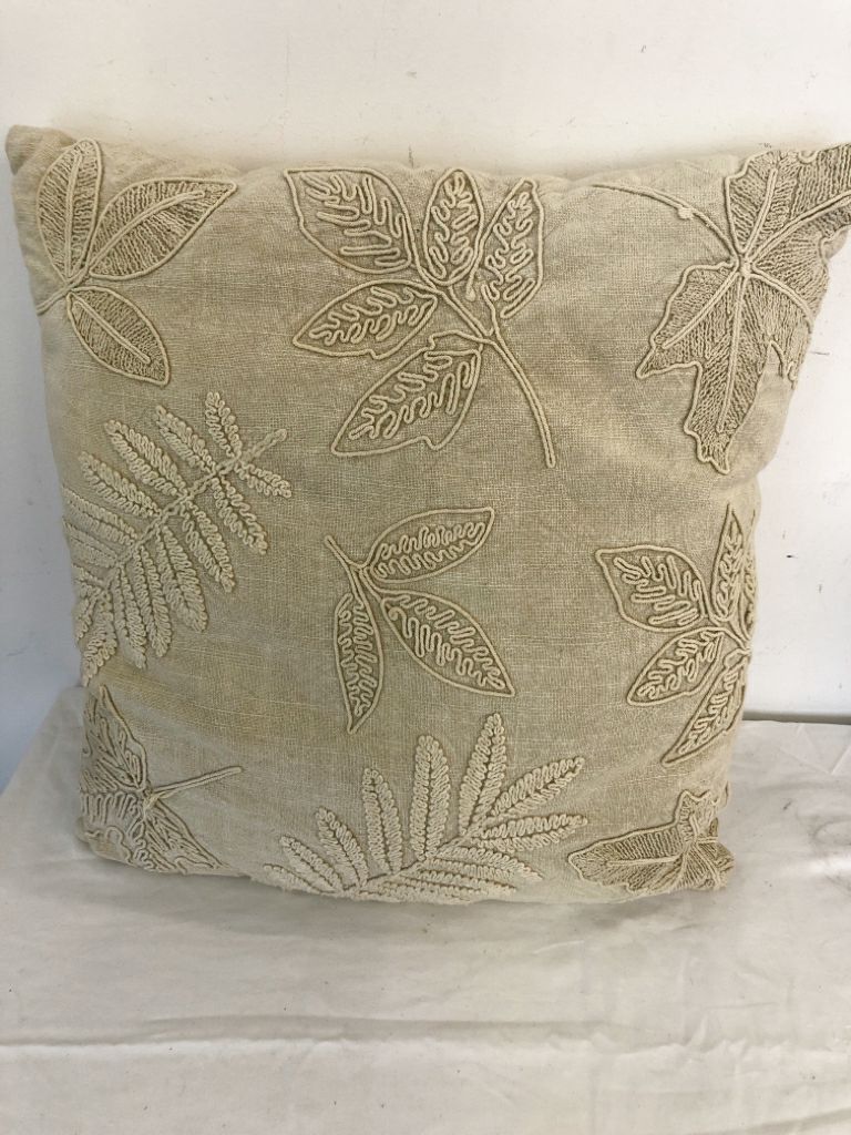 CREAM EMBOSSED LEAF PILLOW.