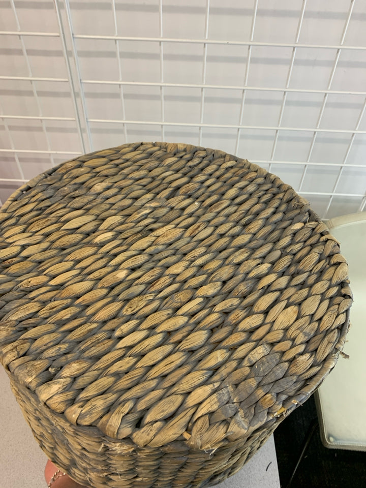 GRAY AND BEIGE WICKER BASKET.
