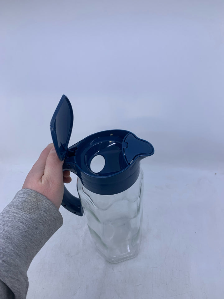 GLASS PITCHER W/ BLUE PLASTIC HANDLE/LID.
