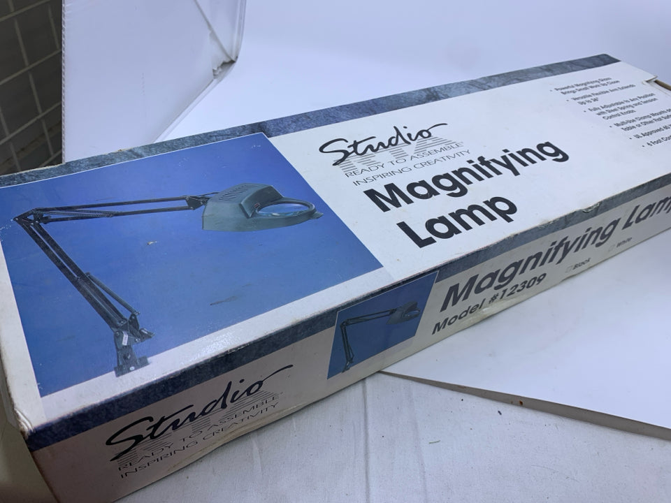 NIB CLAMP ON MAGINFYING LAMP.