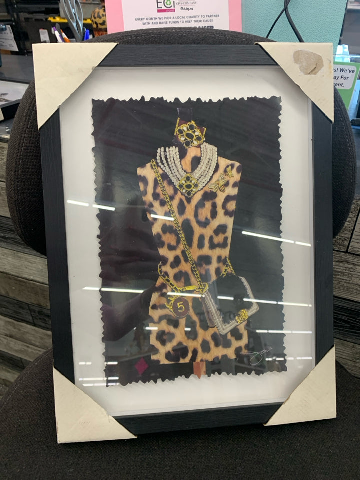 GOLD PARIS MANNEQUIN FORM IN BLACK FRAME.