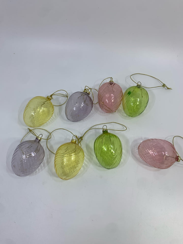 8 COLORFUL EGG SHAPED ORNAMENTS.