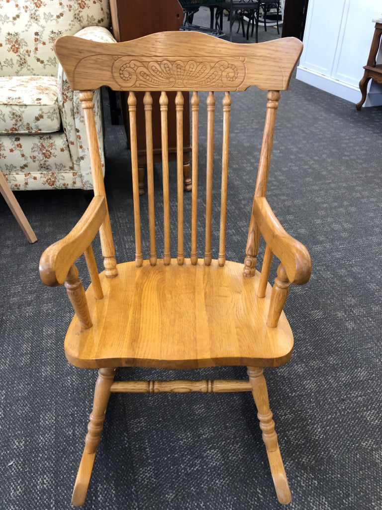 CHILDRENS WOOD ROCKING CHAIR W/ ARM RESTS.