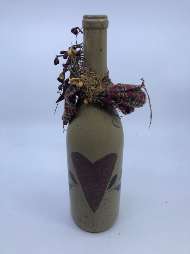 TALL PRIMITIVE BOTTLE W HEART AND PIP BERRIES.