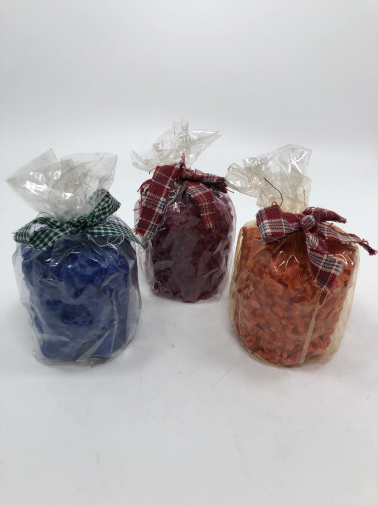 3 MULTI-COLORED TERRY'S VILLAGE CANDLES.
