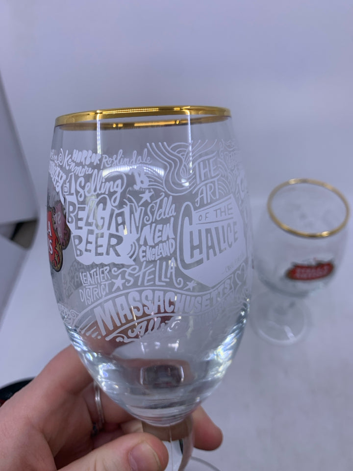2 STELLA ARTOIS BEER GLASSES GOLD RIM.