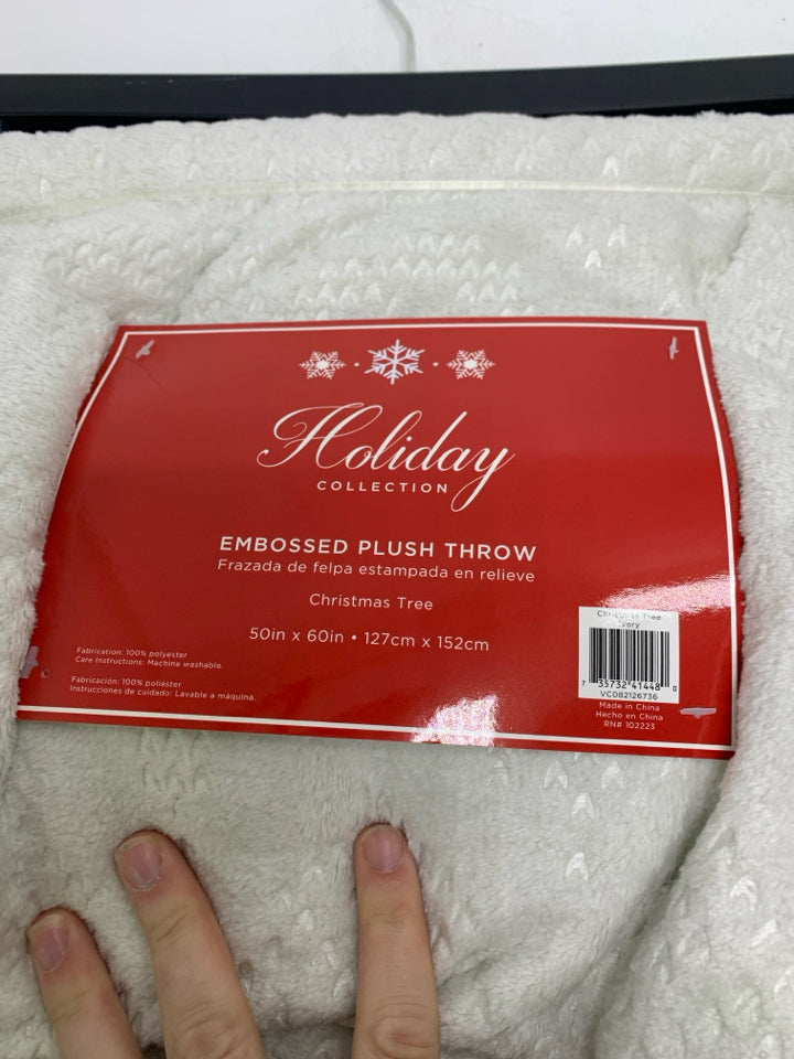 NIP IVORY EMBOSSED CHRISTMAS TREES THROW.