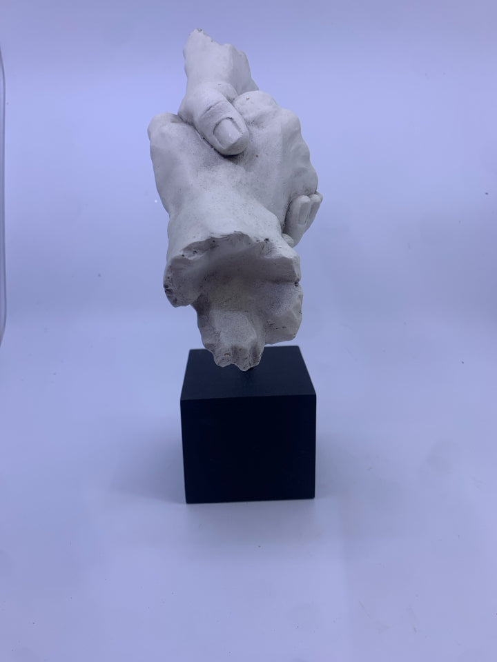 HOLDING HANDS ON HEAVY METAL BLOCK SHELF DECOR.