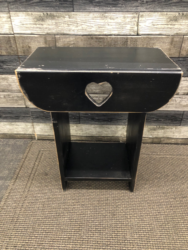 DISTRESSED HEART CUT-OUT BLACK SIDE TABLE.