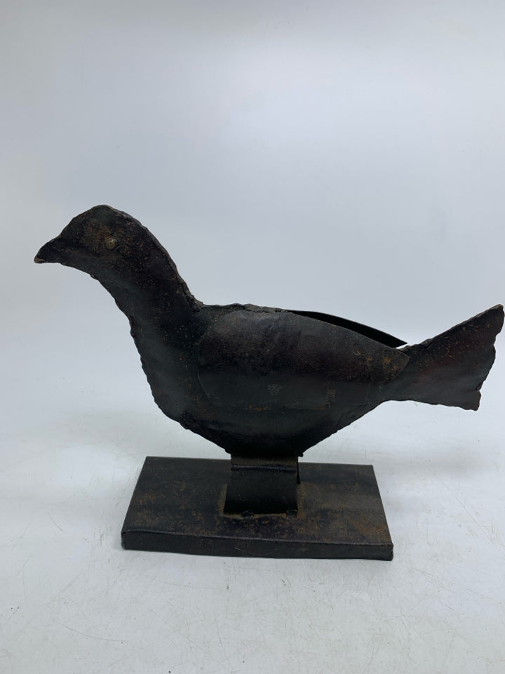 RUSTIC METAL CROW ON STAND.