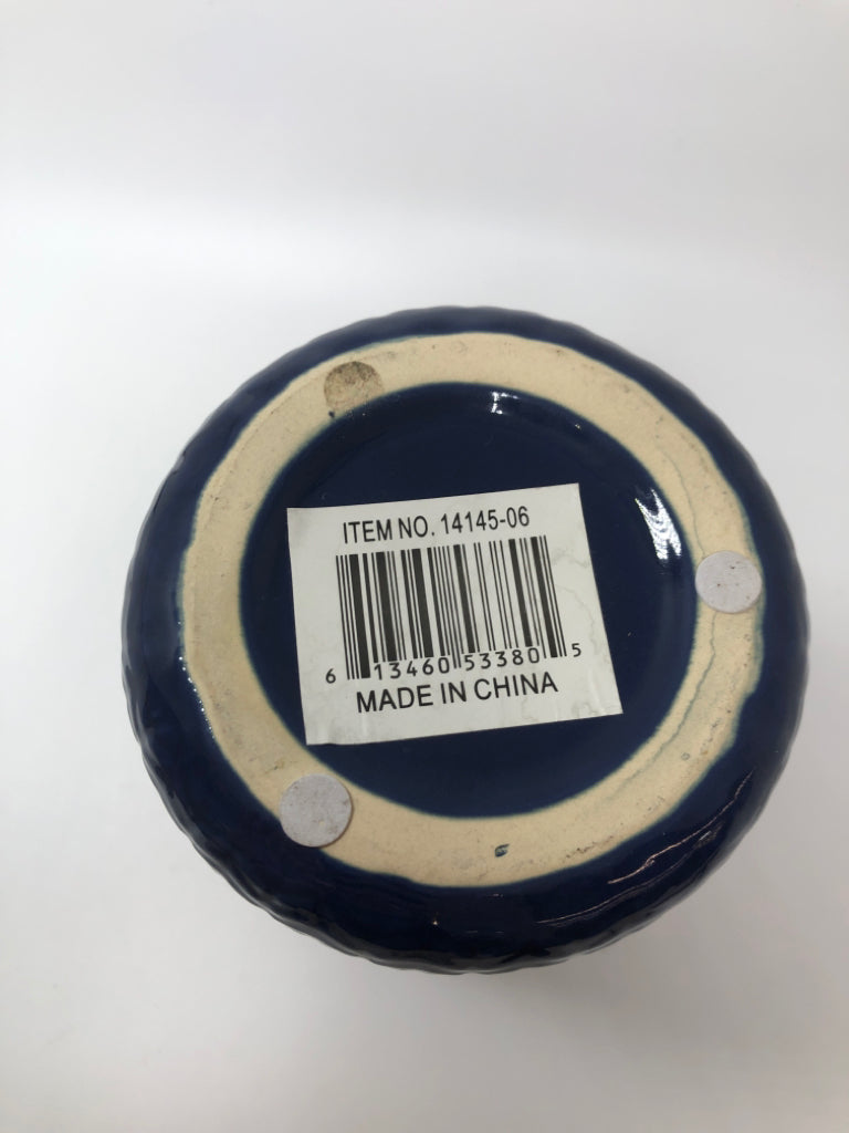 BLUE CERAMIC RIBBED VASE.