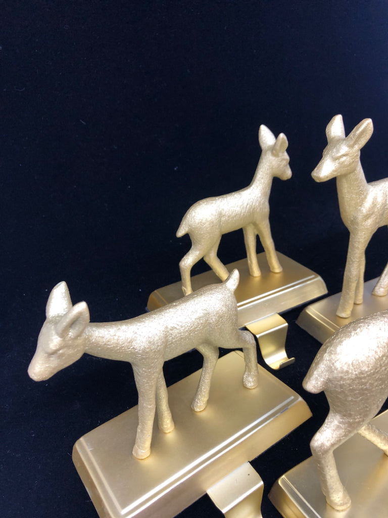 4 GOLD DEER STOCKING HOLDERS.