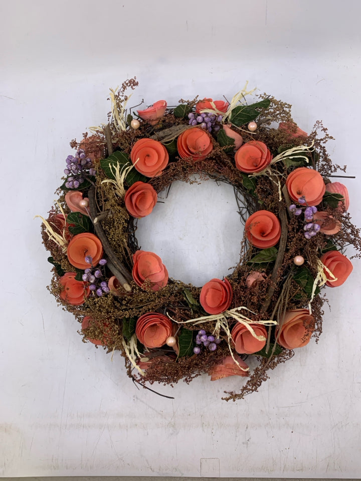 REAL DRIED FLOWERS STICK WREATH W/ PAPER ROLLED PINK FLOWERS.