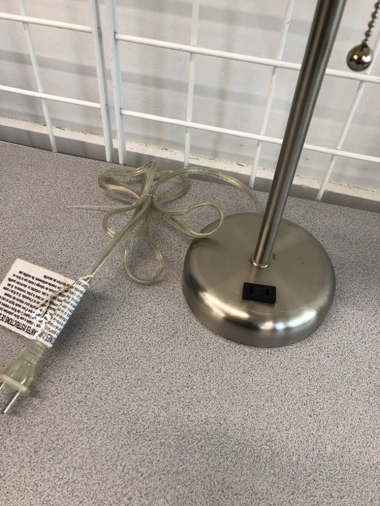 SILVER BASE OUTLET LAMP W/TAN SHADE.