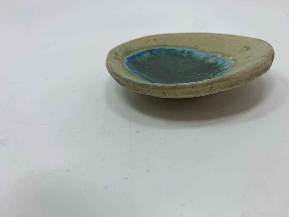 FUSED GREEN GLASS STONEWARE POTTERY DISH.