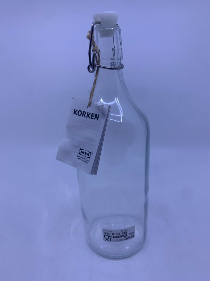 GLASS BOTTLE W/ CLASP AND STOPPER.