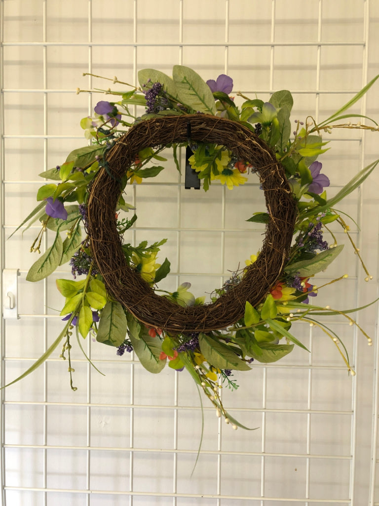 PURPLE AND YELLOW FAUX FLORAL WREATH.