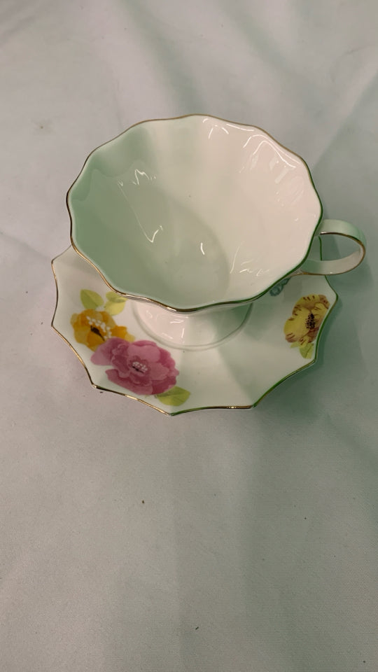 COLORFUL FLORAL TEACUP AND SAUCER.