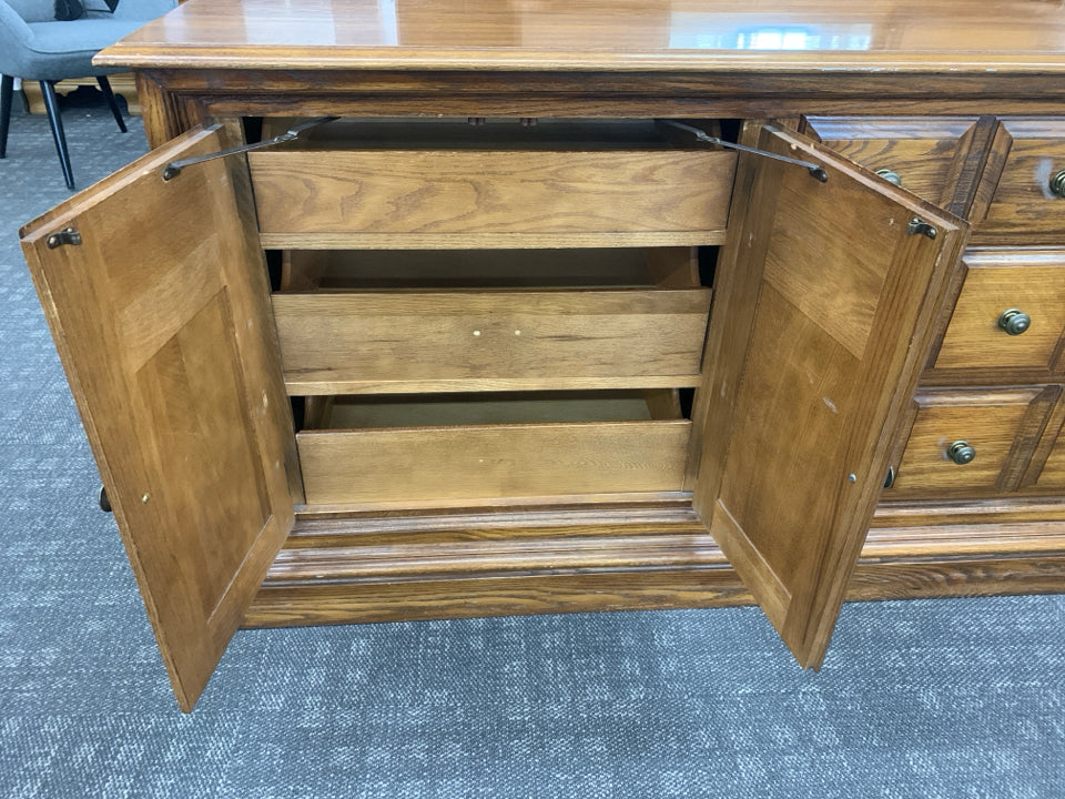 LARGE LONG DRESSER W 3 DRAWERS AND CABINET AND MIRROR.