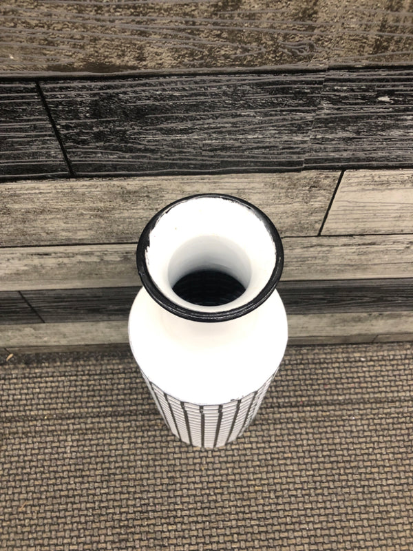 WHITE AND BLACK METAL VASE.